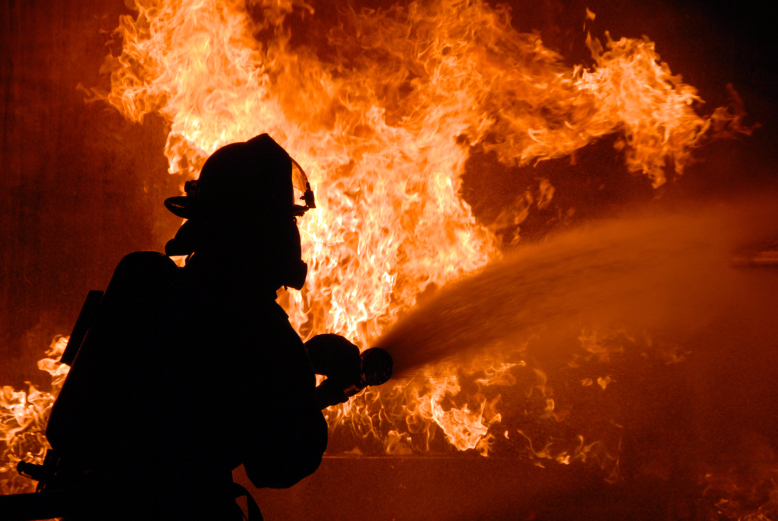 070829-N-4965F-015 PEARL HARBOR, Hawaii (Aug. 29 2007) - Flames push water from a fire hose back as a federal firefighter assigned to Navy Region Hawaii Federal Fire Department combats a fire during an aircraft firefighting training evolution with the Mobile Aircraft Firefighting Training Device (MAFTD) at Navy Region Hawaii Federal Fire Department Headquarters. The MAFTD is a state-of-the-art training tool, which resembles an aircraft and provides different live fire and smoke scenarios for training to increase federal firefighter readiness and their ability to respond to aircraft fire and rescue emergencies. U.S. Navy photo by Mass Communication Specialist 1st Class James E. Foehl (RELEASED)